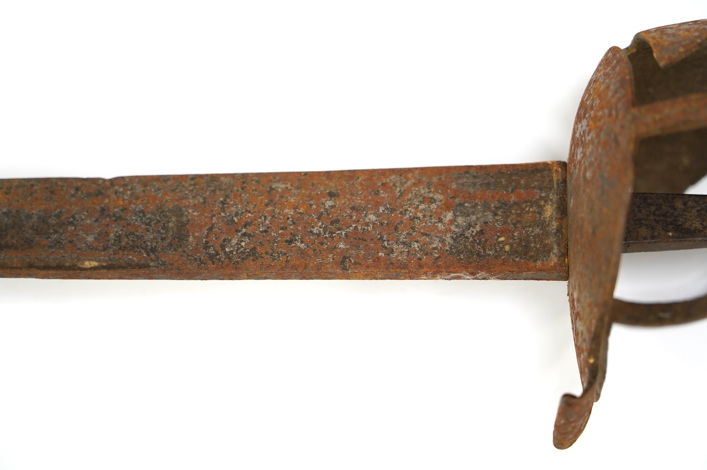 A British cavalry trooper’s sword, c.1750, straight single edged fullered blade, regulation iron hilt, with bun shaped pommel, blade 91.5cm. Condition - fair, rusted overall and grip missing